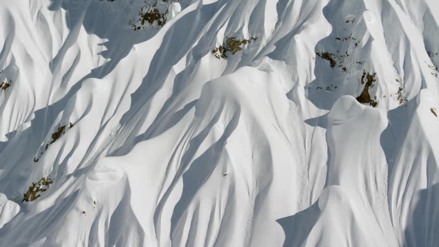 Birds eye view of snow covered mountain peaks