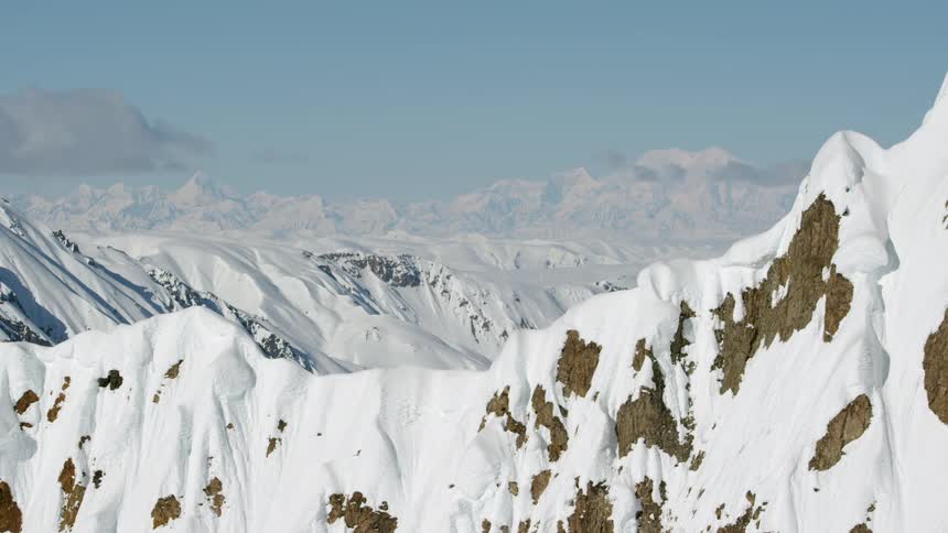 Vast snow covered rugged mountain range