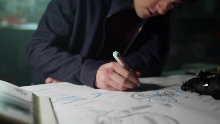 Man working on graphic design at desk