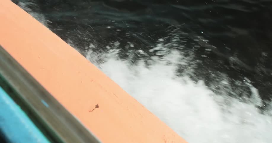 The boat travels fast giving off waves