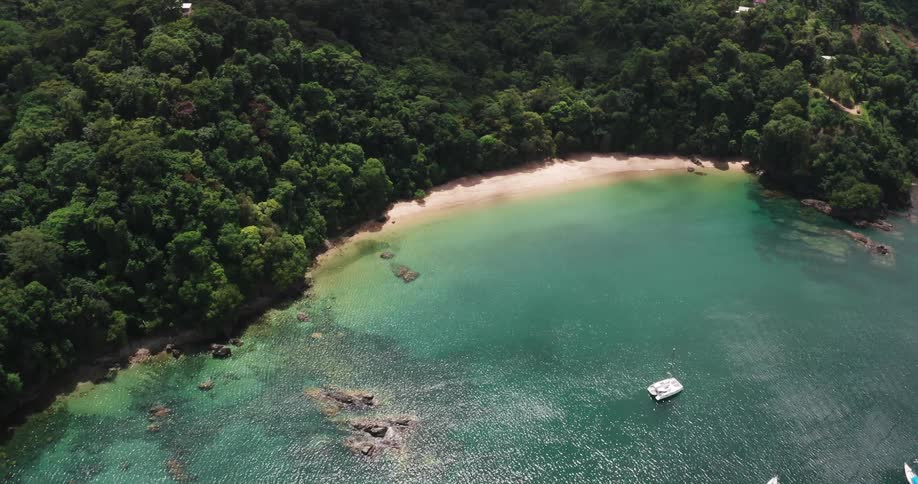 Aerial of boats anchored in tropical island lagoon