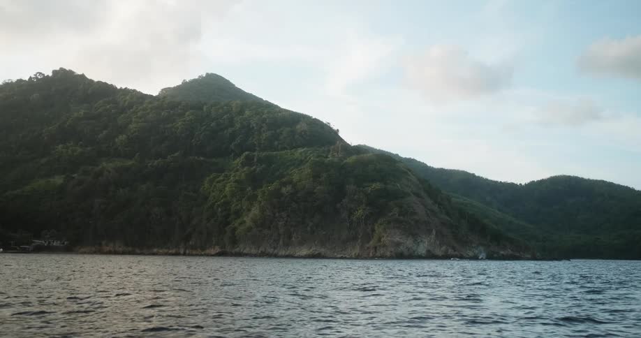 Slo mo view of island from a boat