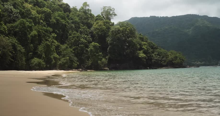 Small waves on secluded island beach
