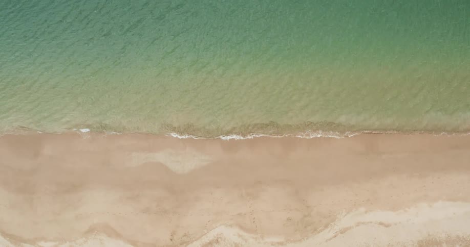 The waves slowly hit the shore