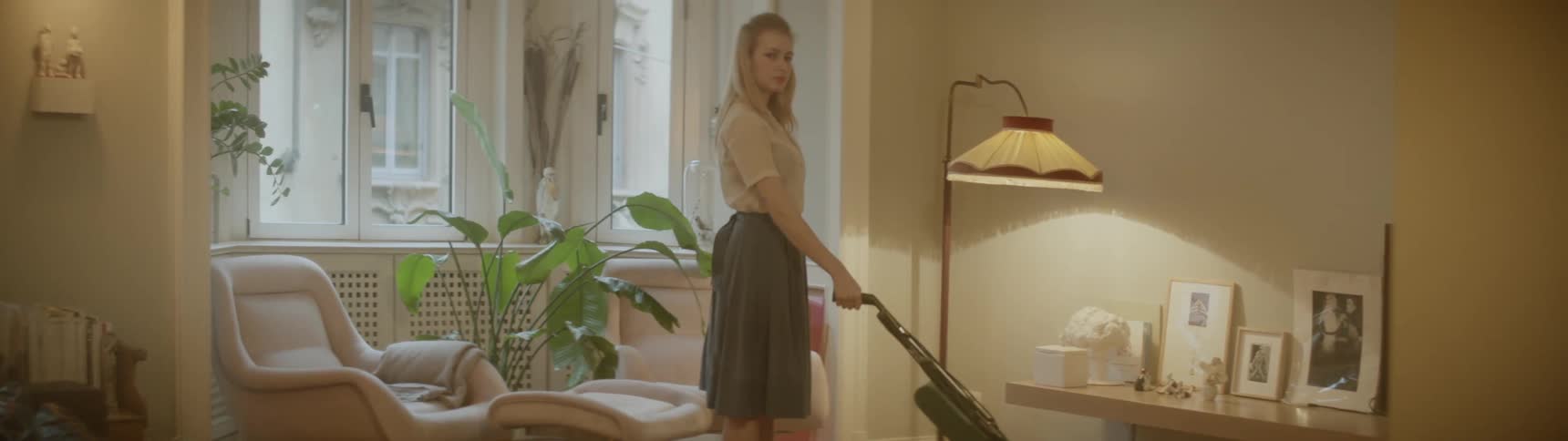 A woman vacuums