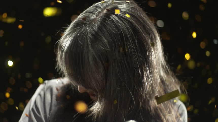 A singer holds a microphone