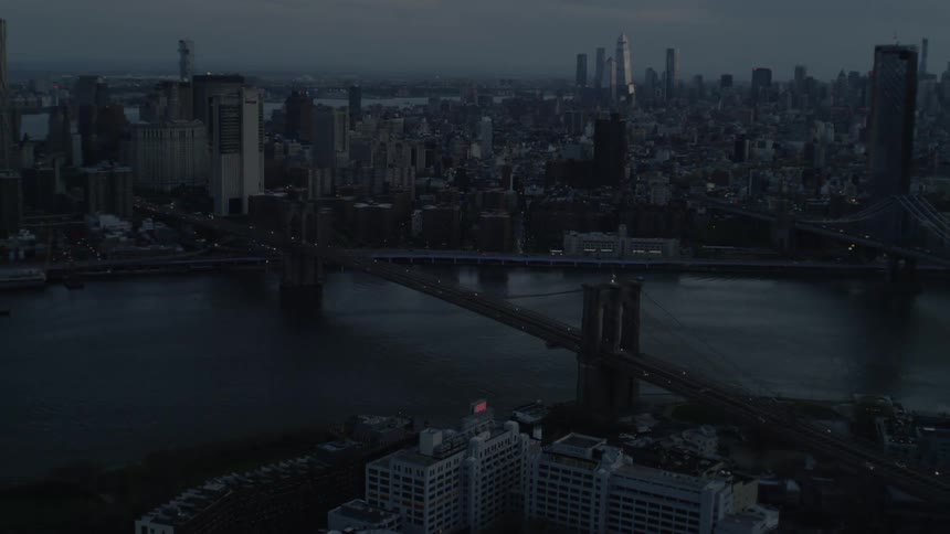 Haze covers city connected by bridge spanning river