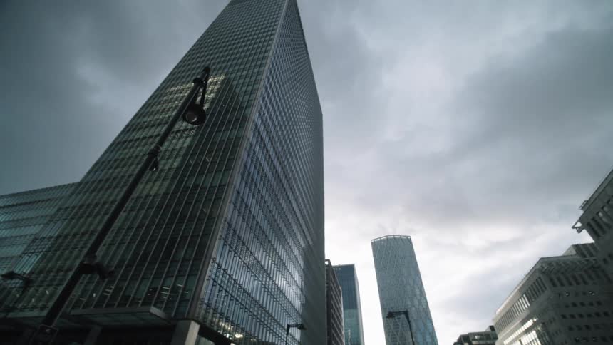 Dark clouds hang over an urban downtown area