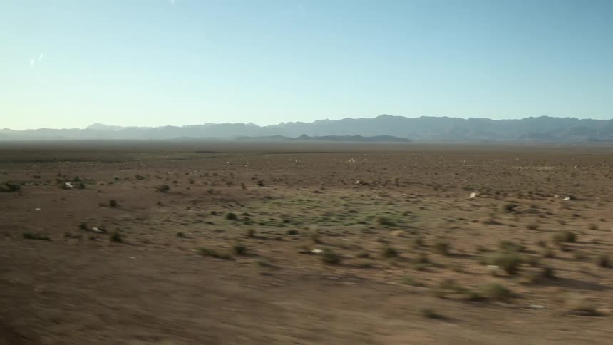 A desert area is displayed during midday