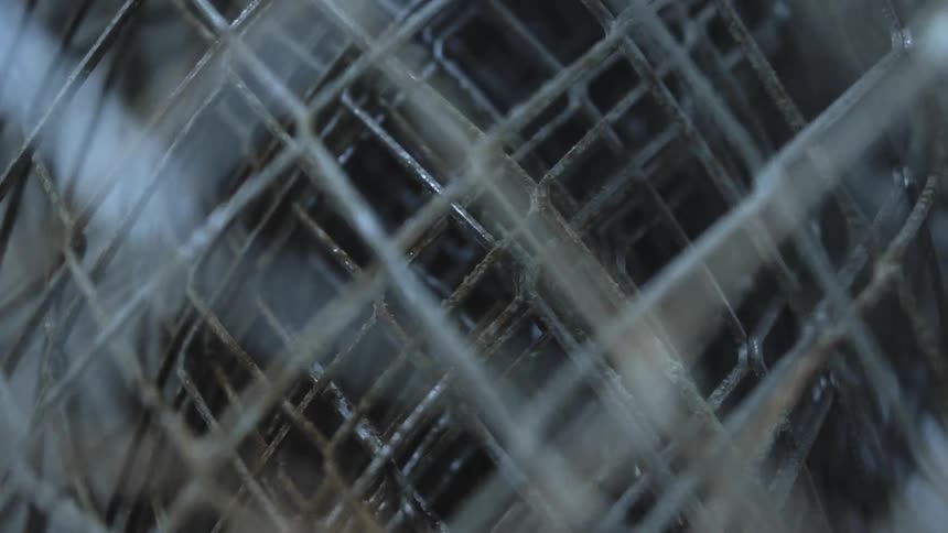 A large bundle of chain link fencing outdoors