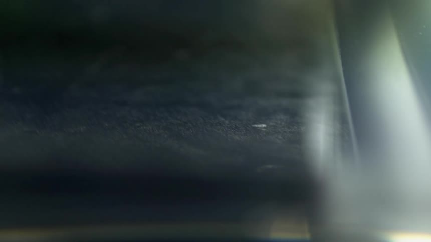 Light glows and highlights threads and dust particles