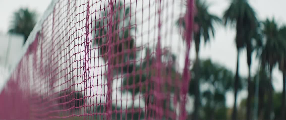 Pink net on tennis court