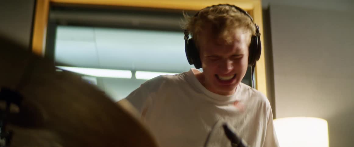 Male drummer plays drums fast