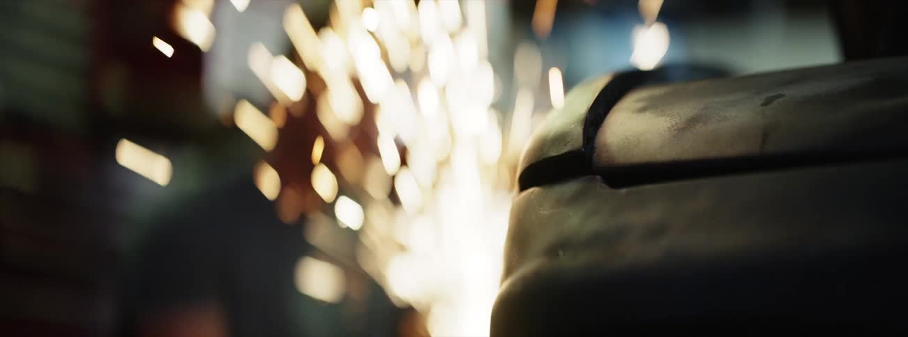 Sparks fly as a man welds
