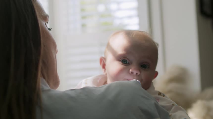 Mother holding young baby