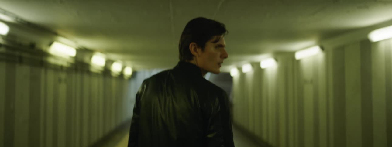 A man is walking through a building