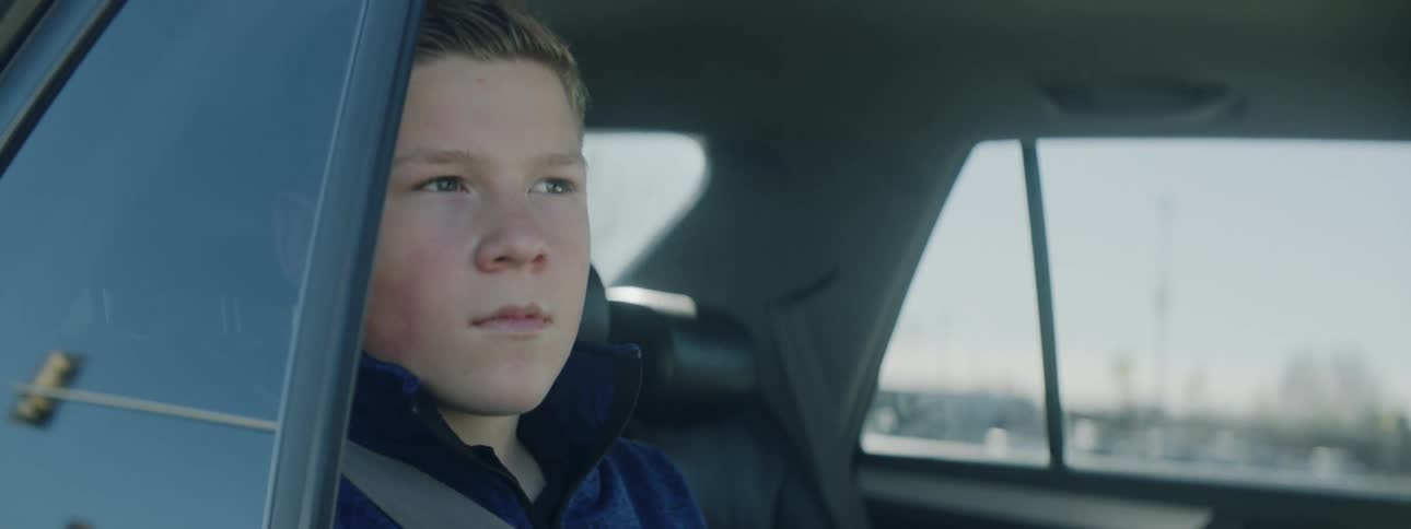 Boy looks out the car window