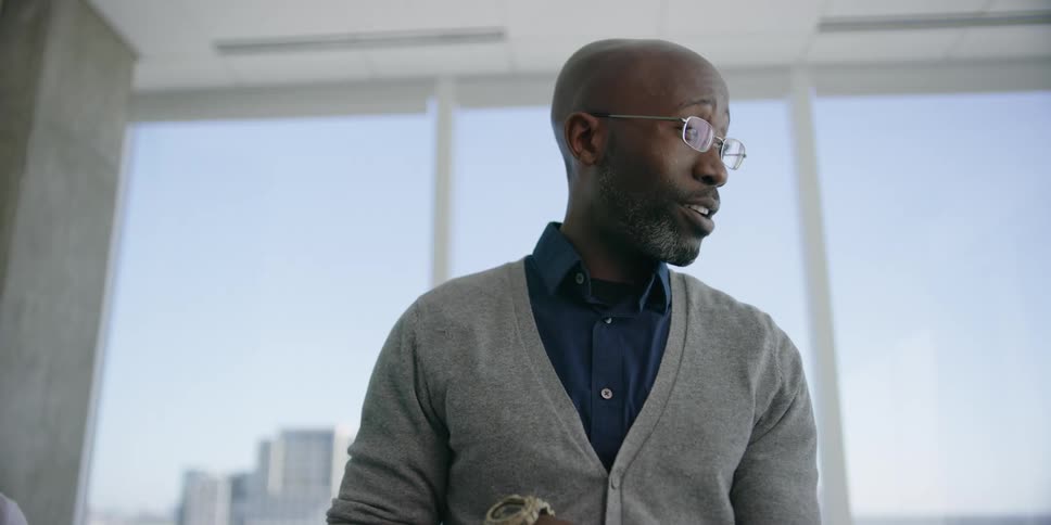 Two men are talking in an office
