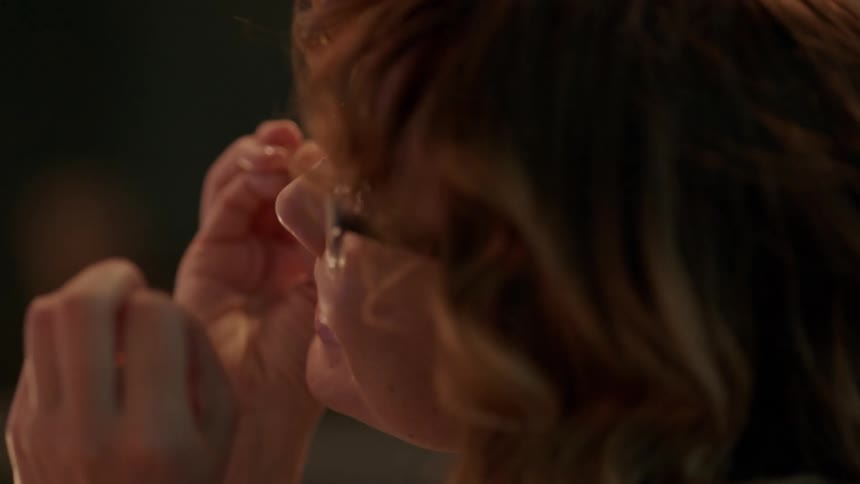 A white women expresses her anger while gesticulating with her hands