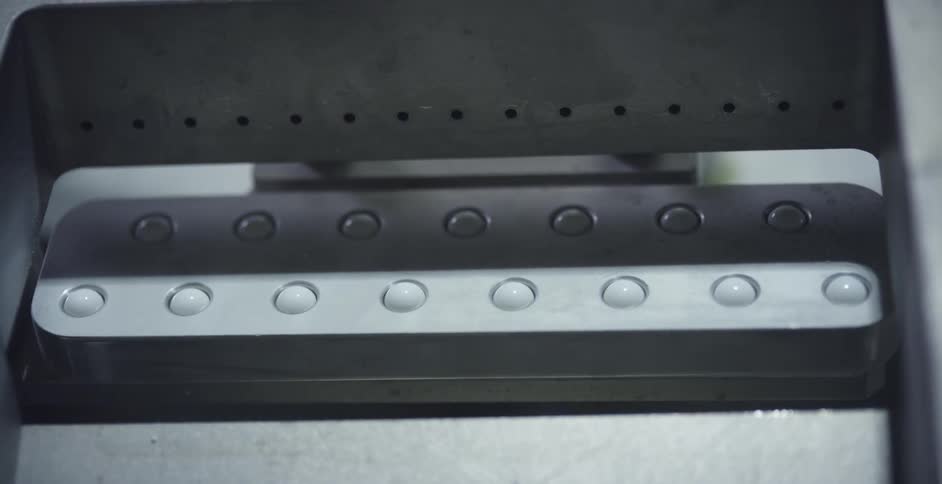 A machine is manufacturing objects