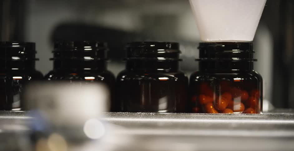 A machine dispenses pills in to bottles