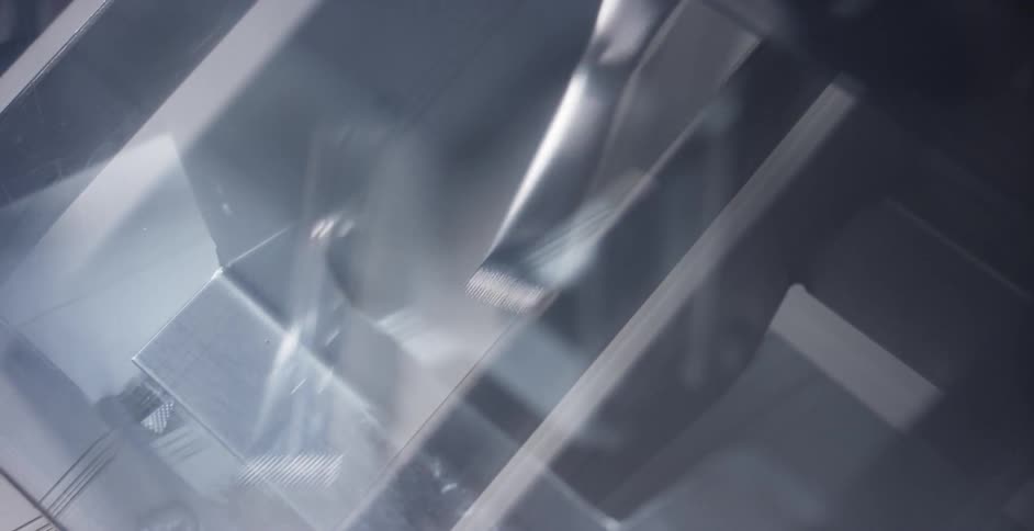 Items move through a machine on a belt