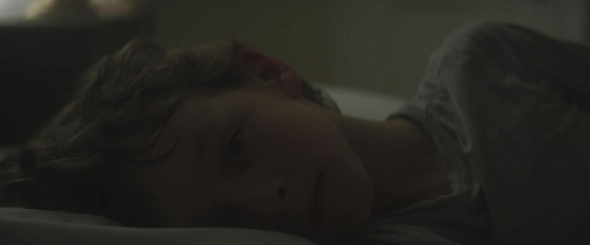 A young boy waking from sleep