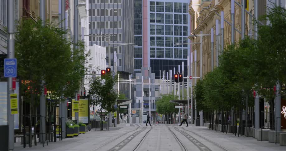 People cross the street in the distance