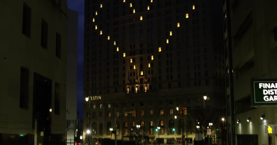 The lights on the side of the building are in the shape of a heart