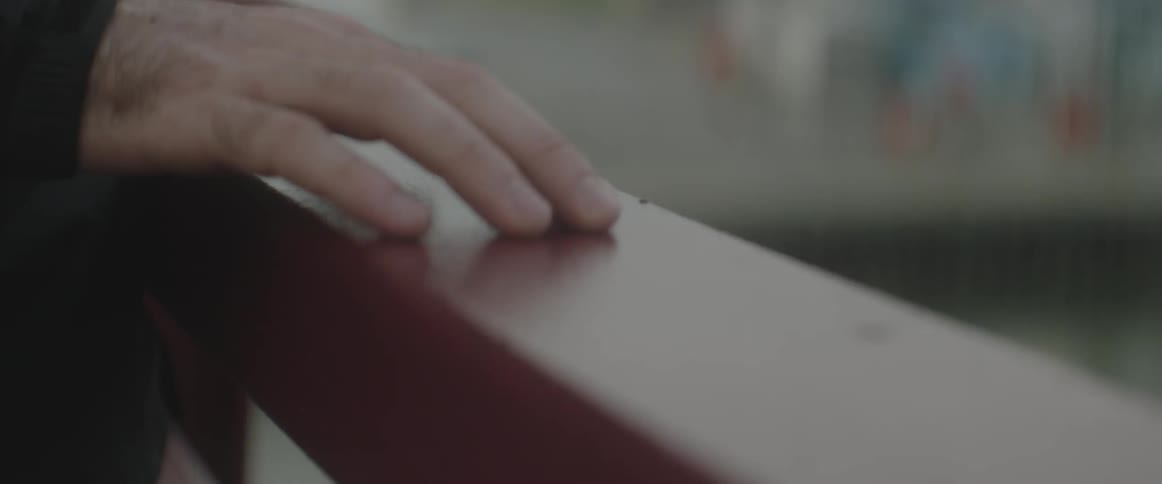 A hand moves over a ledge
