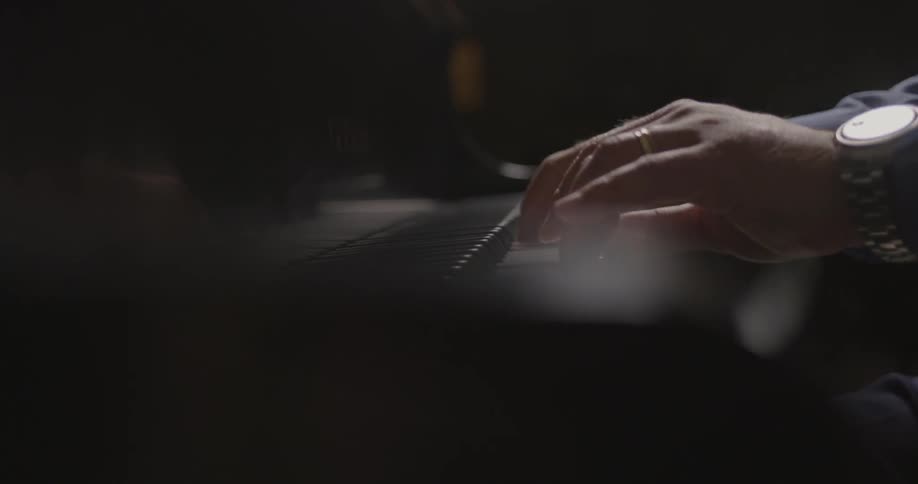 A man plays piano