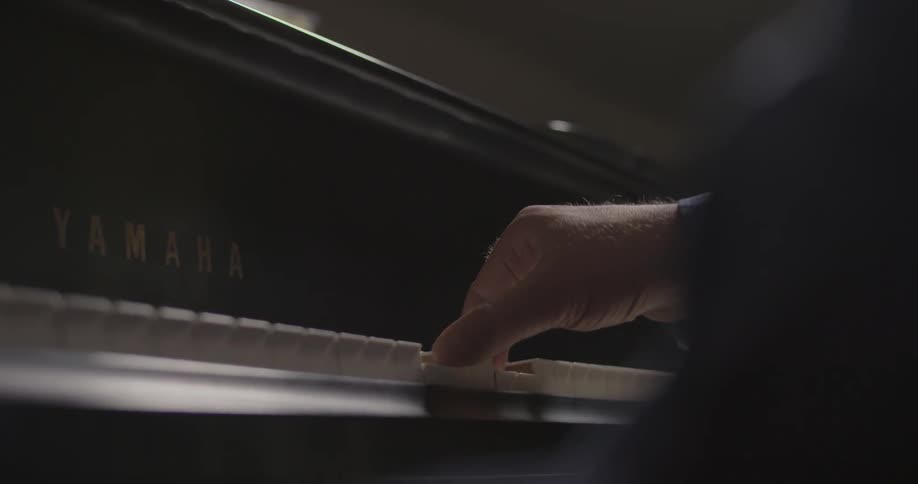 A man plays the piano