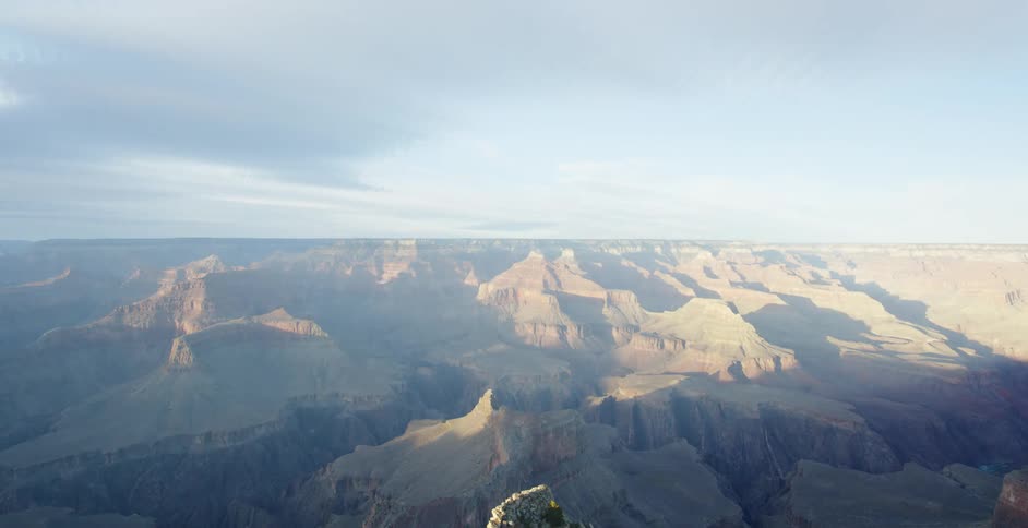 Clouds float over grand canyon at sunset