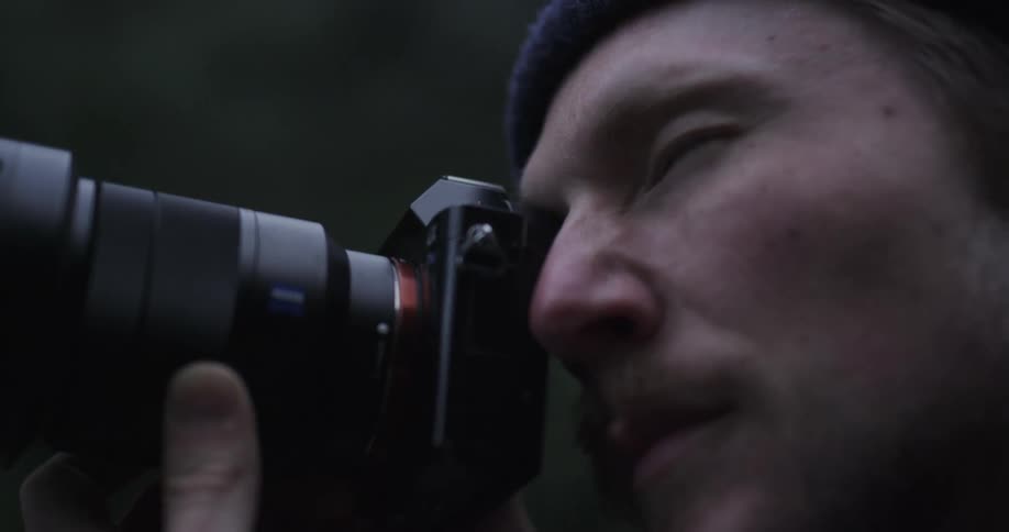 Male photographer takes photographs
