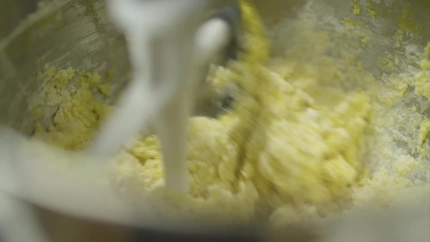 Flour and butter are mixed together in a stand mixer