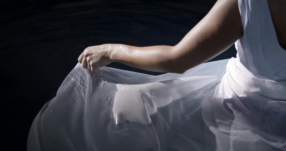 Woman Wearing A Dress Walking Into Water