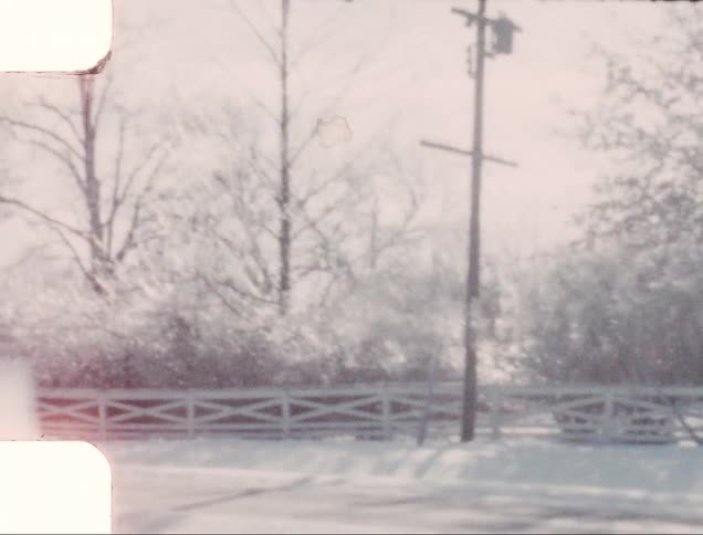 Vintage film of snow covered rural roads at winter