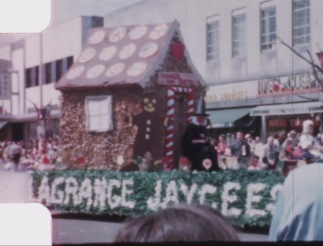 Homemade float driving by at a hometown christmas parade