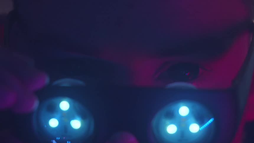 A man takes off virtual reality glasses