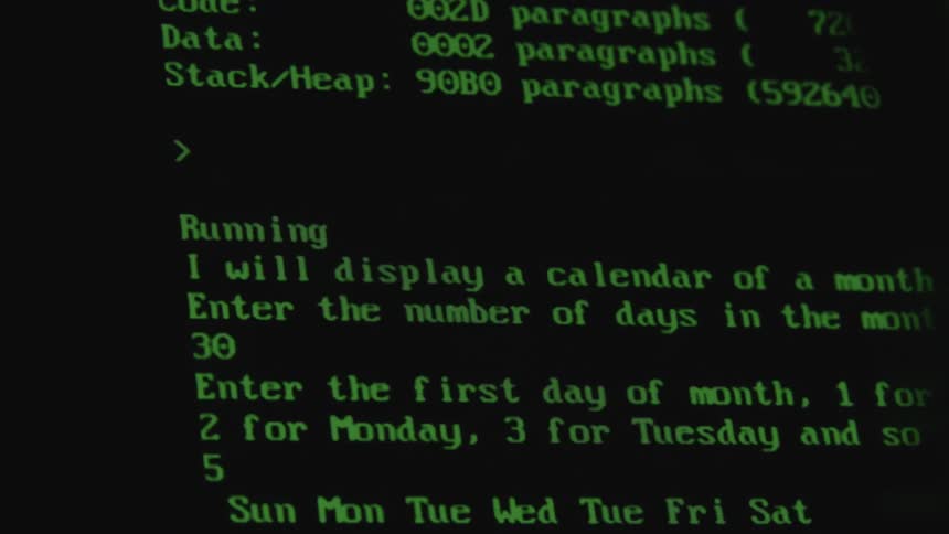 Computer code and texts scrolls up a monitor screen