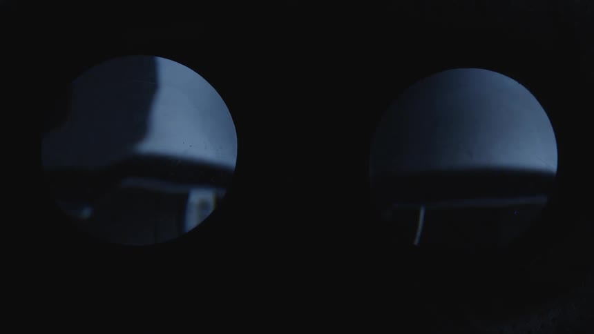 Light flashes on the surfaces of dark lenses