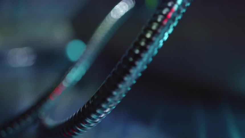 Metallic tubes and cables connected to futuristic electronic machinery