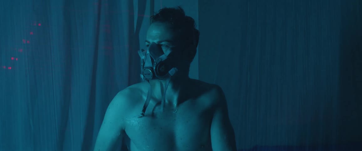 A teen with a device that looks like a respirator looks around