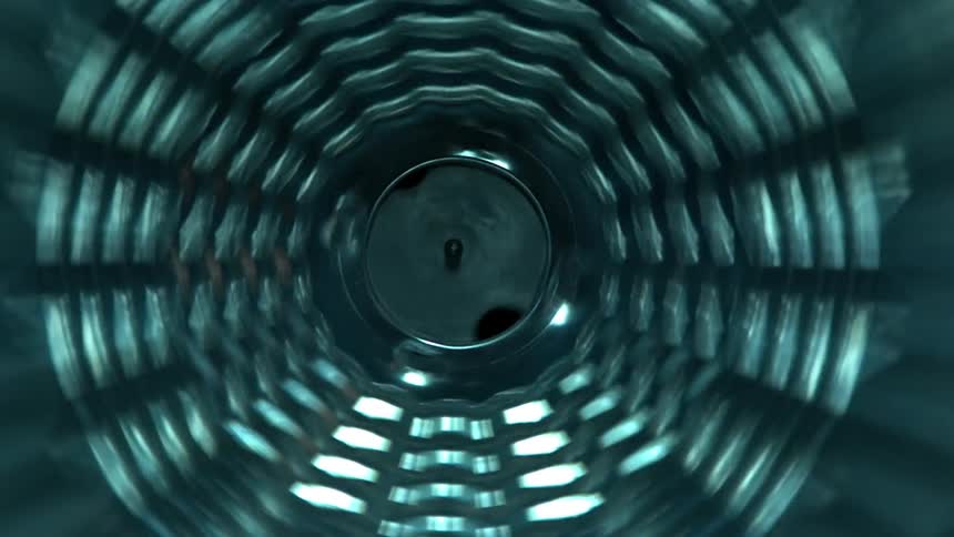 An abstract object spinning as light shines through