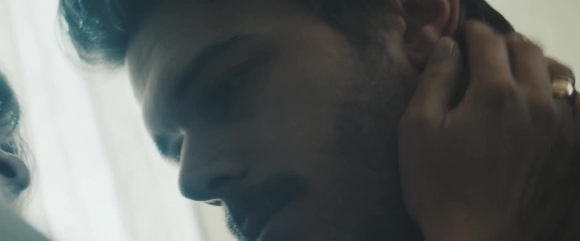 Couple touch each other in the face closely