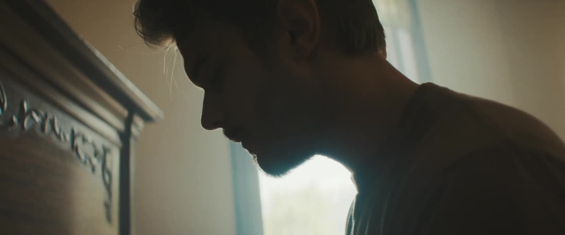 Male pianist plays the piano in the room
