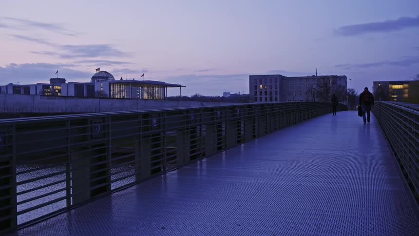 People walking across a bridge