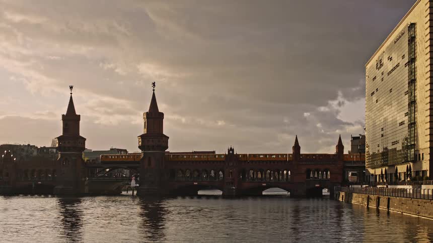 A train travels over the Oberbaum Bridge in Berlin