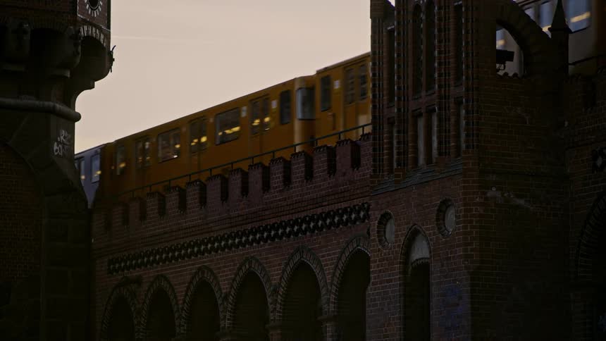 A train rolls over a brick structure