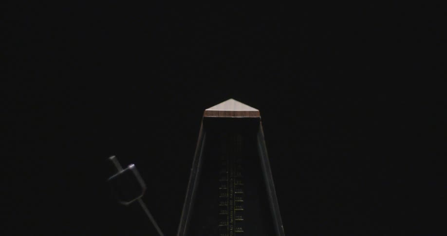 A metronome moving back and forth